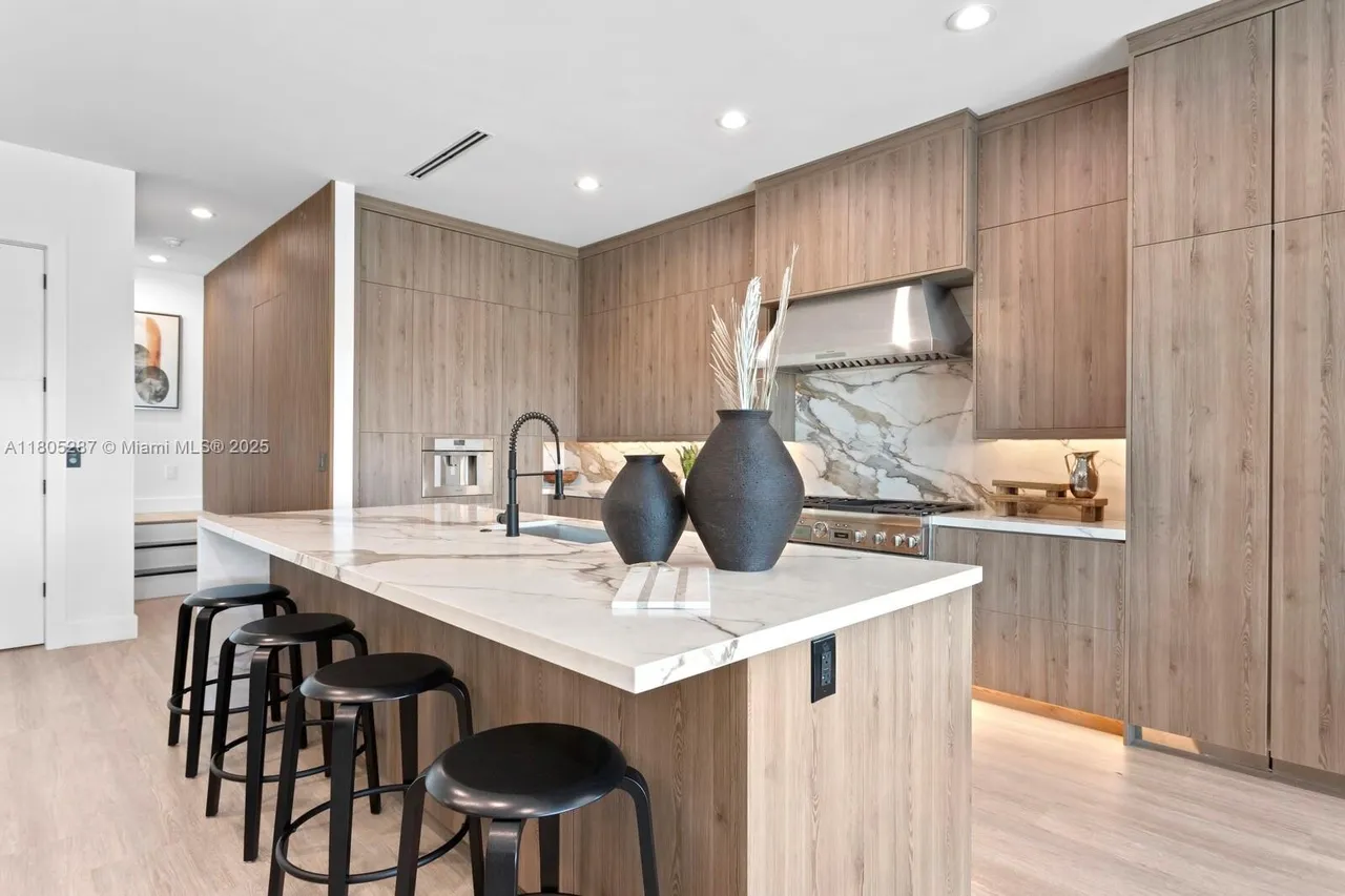Completed IQ+ kitchen with island and pendant lighting